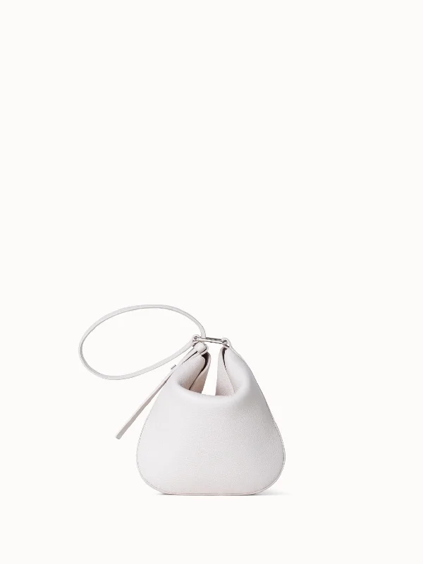 Hobo bag with a tassel - trimmed strap for a playful touchAnna Little Hobo