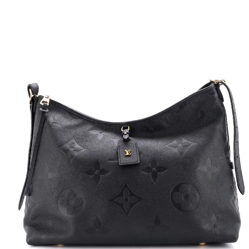 Studded hobo bag with a punk - rock edgeCarryAll Hobo Monogram Empreinte Giant MM