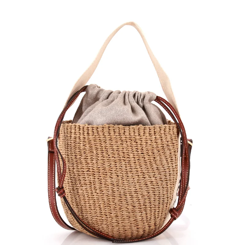 Plus - size bucket bag with a spacious interior for carrying daily essentialsx Mifuko Woody Basket Bag Raffia Small