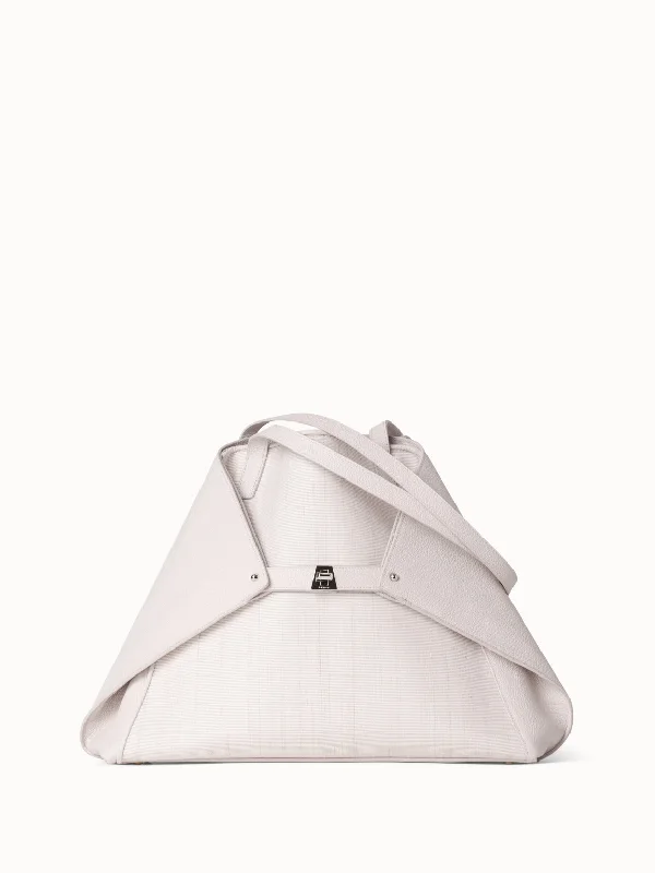 Studded leather shoulder bag with a punk - rock aestheticAi Medium Shoulder Tote