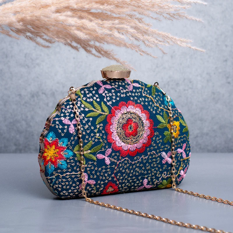 Metallic leather evening bag with a textured finishArtklim Blue Based Red And Pink Floral Embroidery Clutch