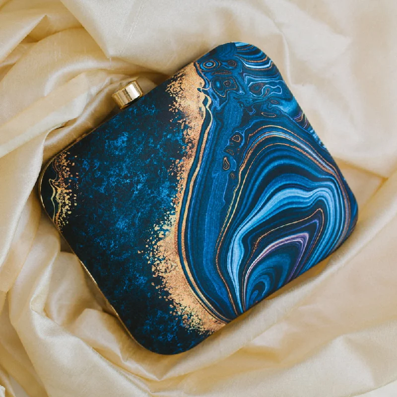 Velvet clutch with a tassel detail for a bohemian - chic styleArtklim Blue Gold Printed Clutch