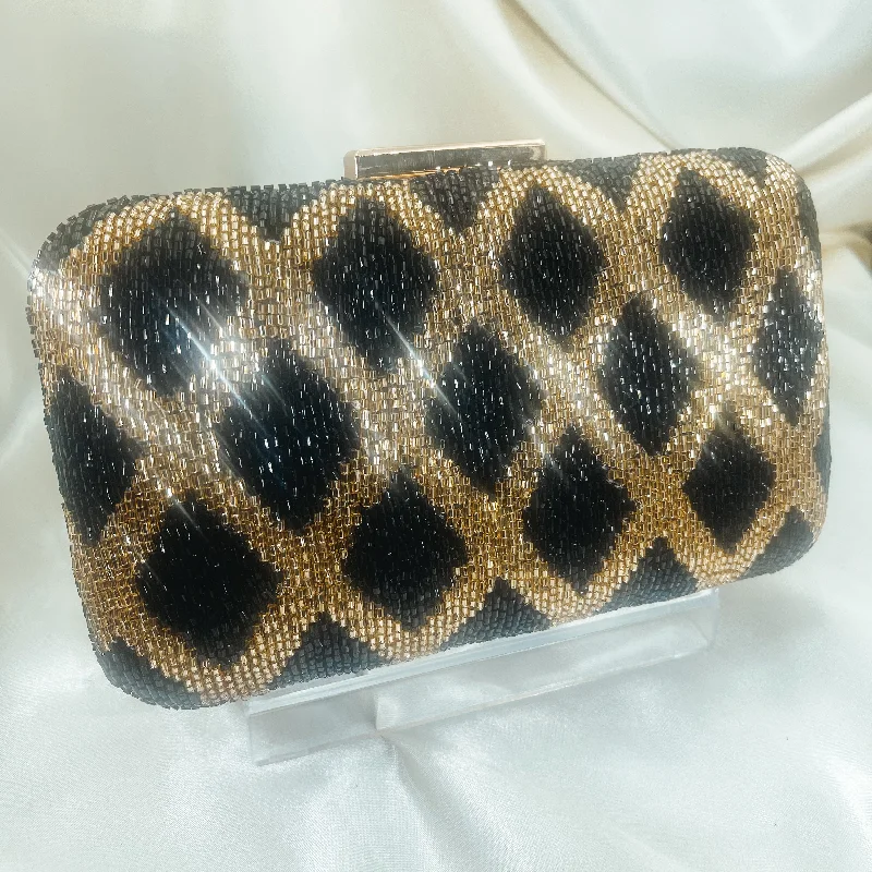 Laser - cut leather evening bag with an intricate patternGALA Clutch (Gold and Black)