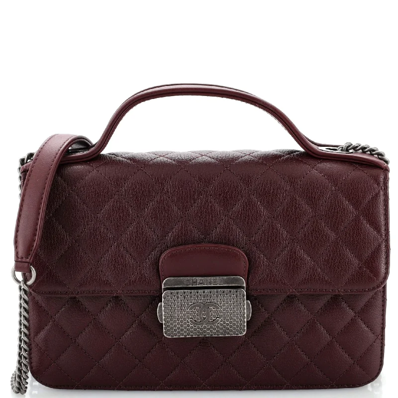 Faux fur satchel with a fluffy exterior for a winter fashion statementCC University Flap Bag Quilted Goatskin Small