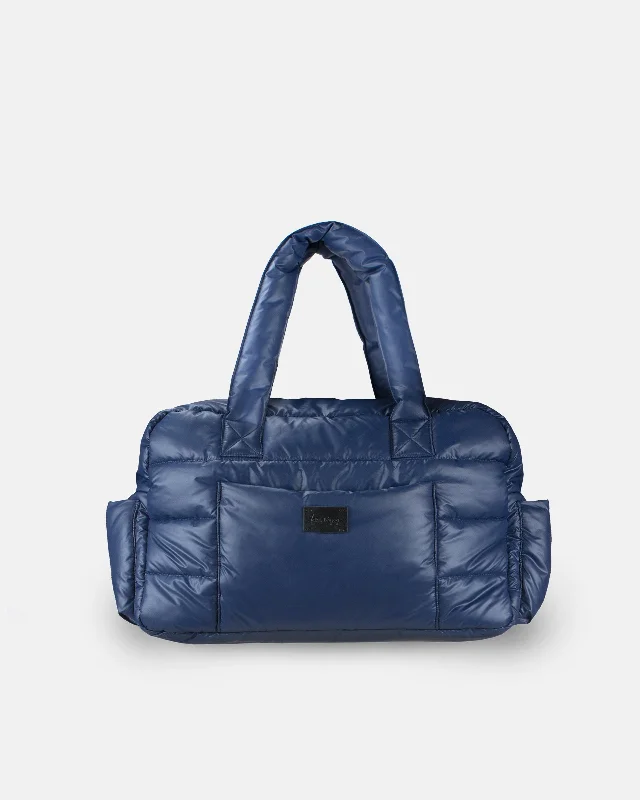 Vintage - style leather handle bag with a structured silhouette and a tassel charmSoho Carryall - Navy