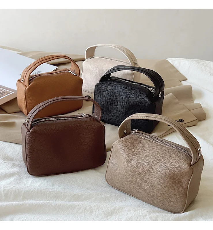 Color - blocked handle bag with a combination of bright and neutral colorsElena Handbags Retro Leather Camera Shoulder Bag