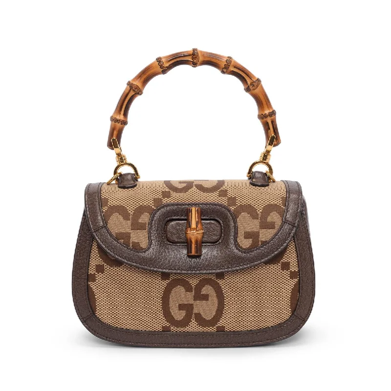 Handle bag with multiple interior compartments and a zippered pocket for organizationGucci Brown Jumbo GG Small Bamboo 1947 Bag