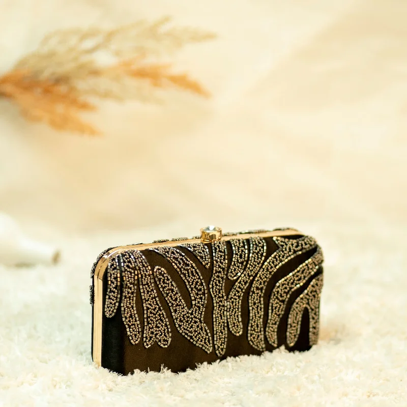 Monogrammed clutch as a personalized evening accessoryKerala Regal Clutch