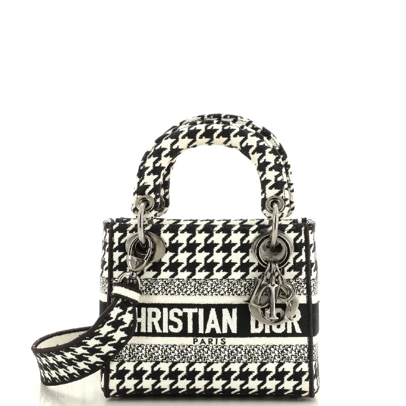 Vintage-inspired satchel with a brass buckle and leather tasselsLady D-Lite Bag Houndstooth Canvas Mini