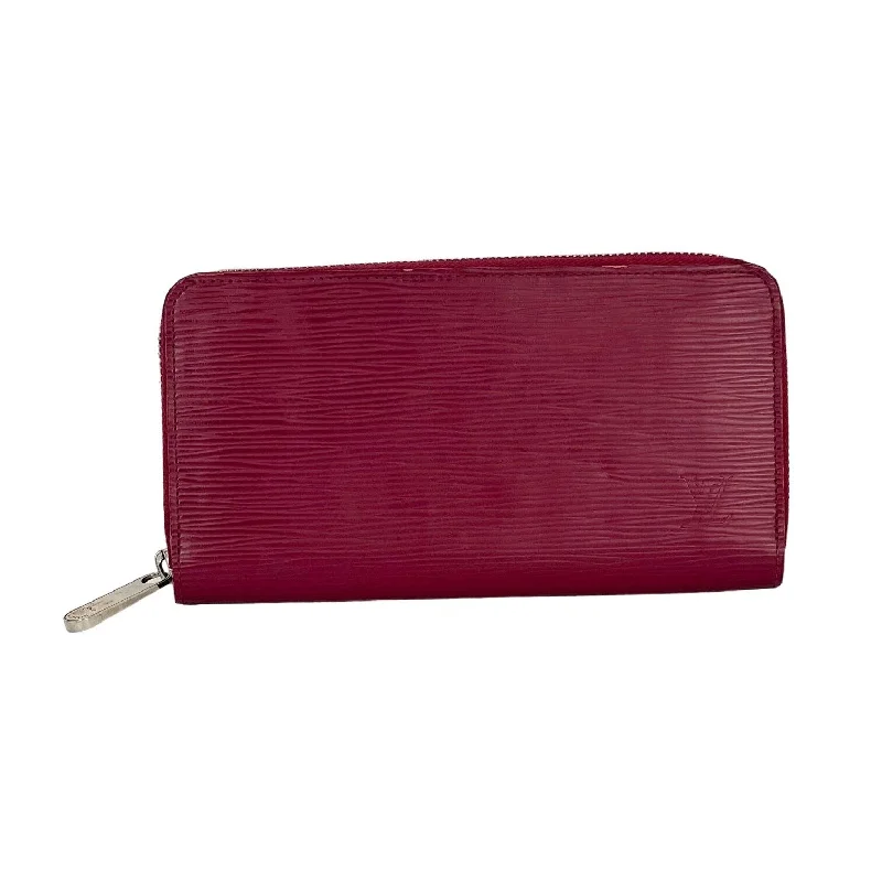 Mother - of - pearl clutch with a delicate sheenLOUIS VUITTON Zippy Epi  Pink Leather Wallet Clutch