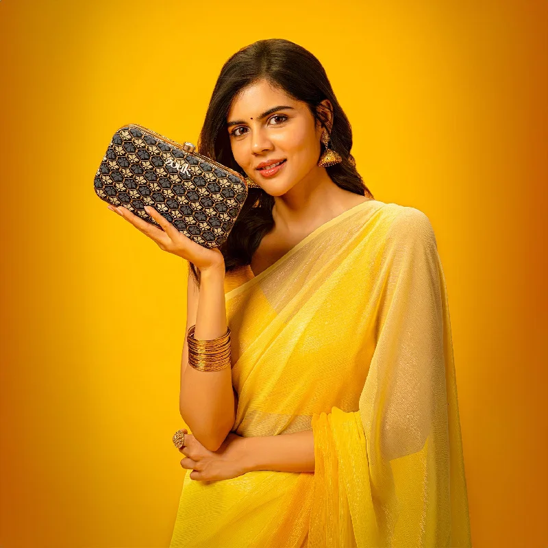 Patent leather clutch with a modern, minimalist designLucknow Bidri Clutch