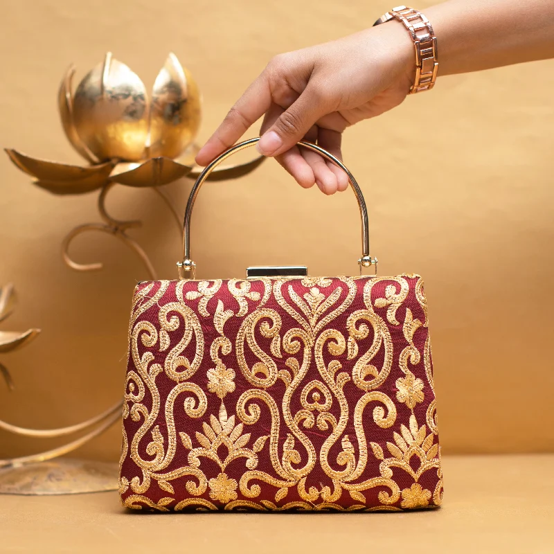 Two - tone clutch with a contrast color lining for added styleMaroon And Golden Multipattern Embroidery Clutch