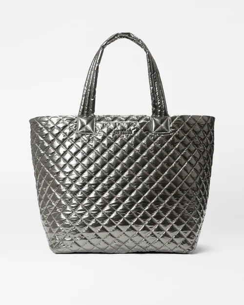 Leatherette handle bag with a quilted diamond pattern and a magnetic snap closureMetro Tote Deluxe Large Pewter Metallic