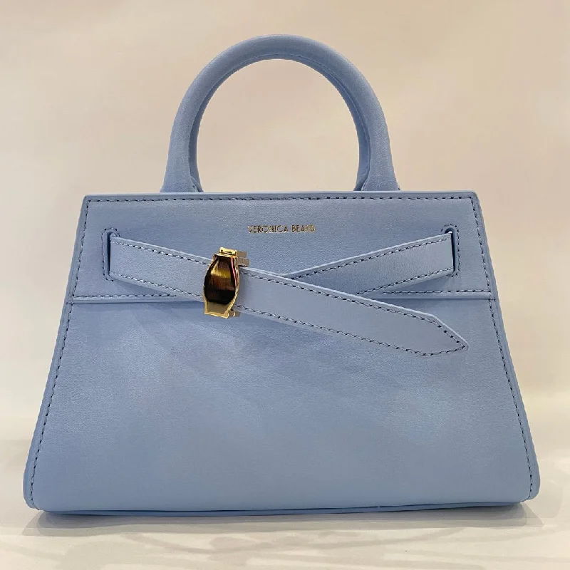 Silk - lined handle bag with a smooth interior to protect belongingsMini Dash Bag Light Blue