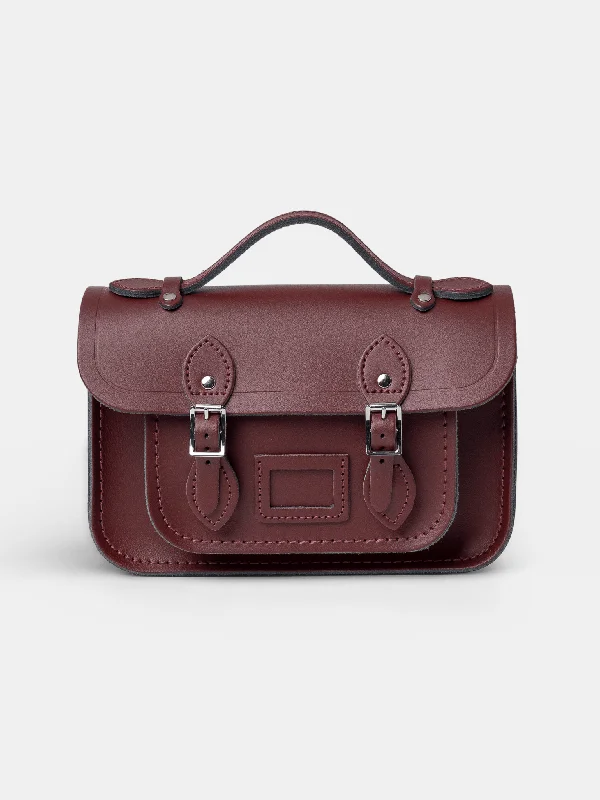 Laser - cut leather handle bag with a geometric pattern for a modern and edgy lookThe Mini -  Oxblood