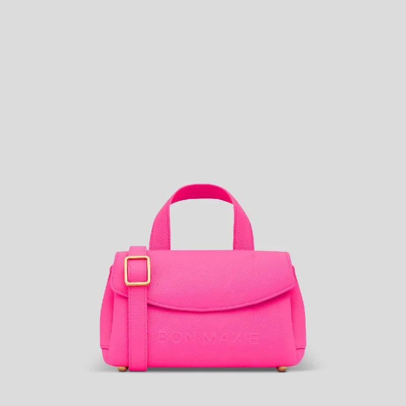 Color - blocked handle bag with a combination of bright and neutral colorsMini Tryhard Top Handle Bag -- Neon Pink