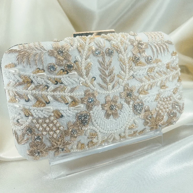 Laser - cut leather evening bag with an intricate patternNAINA Clutch