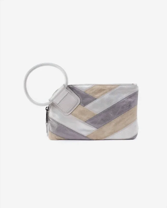 Velvet clutch with a tassel detail for a bohemian - chic styleSable Hobo Wristlet In Silver