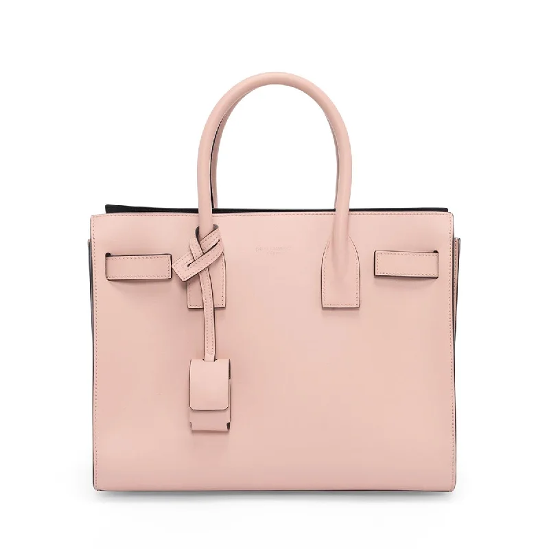 Silk - lined handle bag with a smooth interior to protect belongingsSaint Laurent Pink Smooth Calfskin Baby Sac de Jour Bag