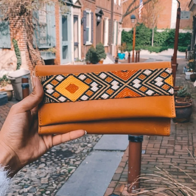 Metallic leather evening bag with a textured finishTilet Wallet: Rust Brown